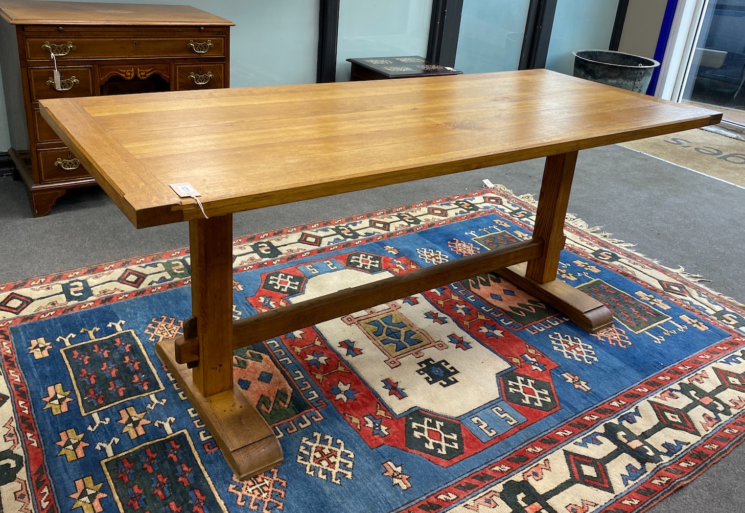 An Arts and Crafts style rectangular light oak refectory dining table, length 183cm, width 76cm, height 76cm